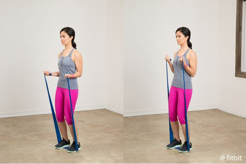 woman doing Resistance Band Bicep Curls