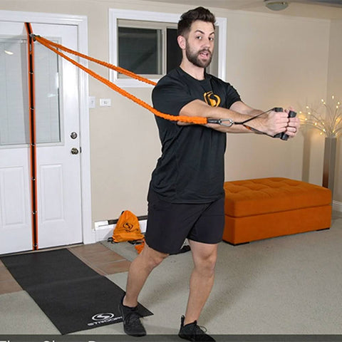man doing resistance band chest flies