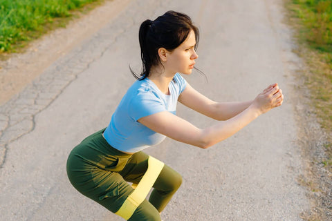 woman doing banded squats