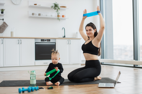 parent using resistance bands with child