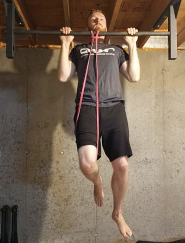 man lifting weights with resistance bands