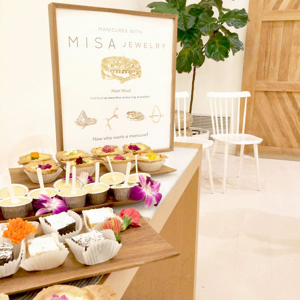 Misa Jewelry rings next to delicious treats 