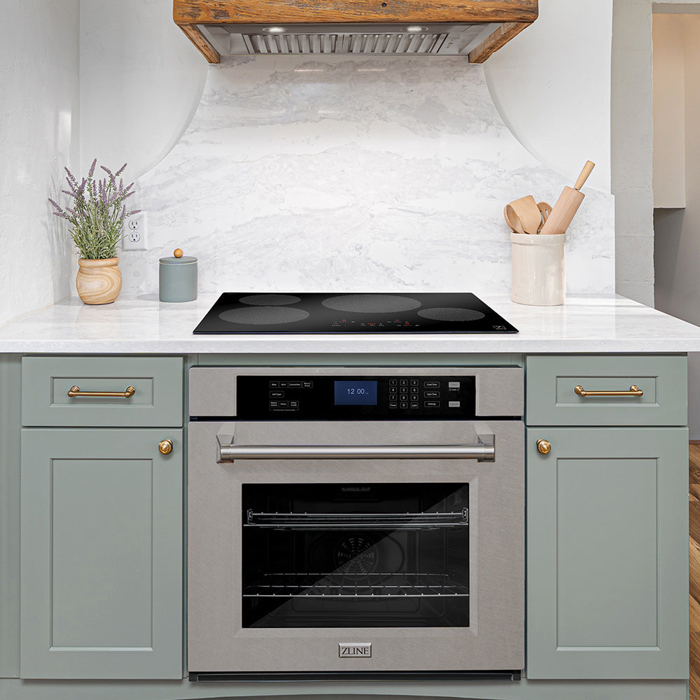 ZLINE induction cooktop above an oven in a kitchenette