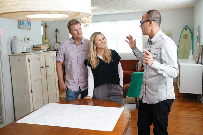 Marcus Lemonis on the set of HGTV's The Renovator with young couple