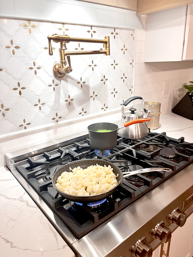 ZLINE rangetop and pot filler featured on Rachael Ray's Rebuild