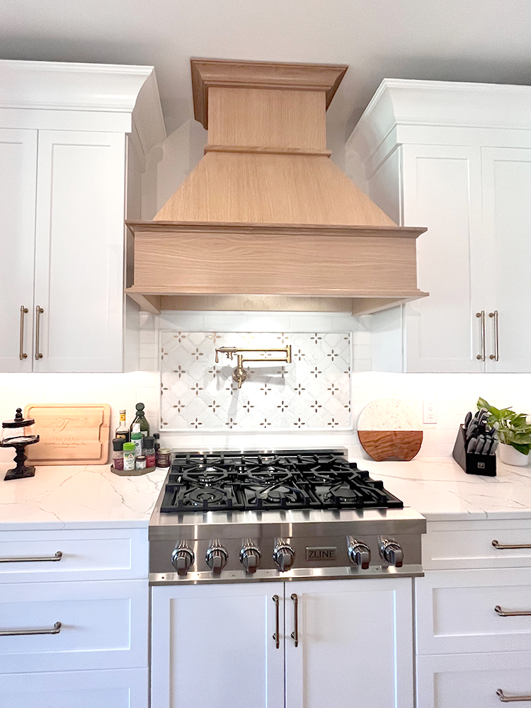 ZLINE rangetop, pot filler, and range hood featured on Rachael Ray's Rebuild