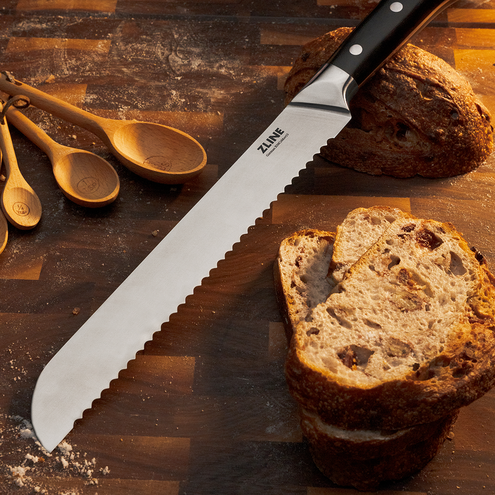 ZLINE German steel 9-inch bread knife on a cutting board with Sourdough loaf