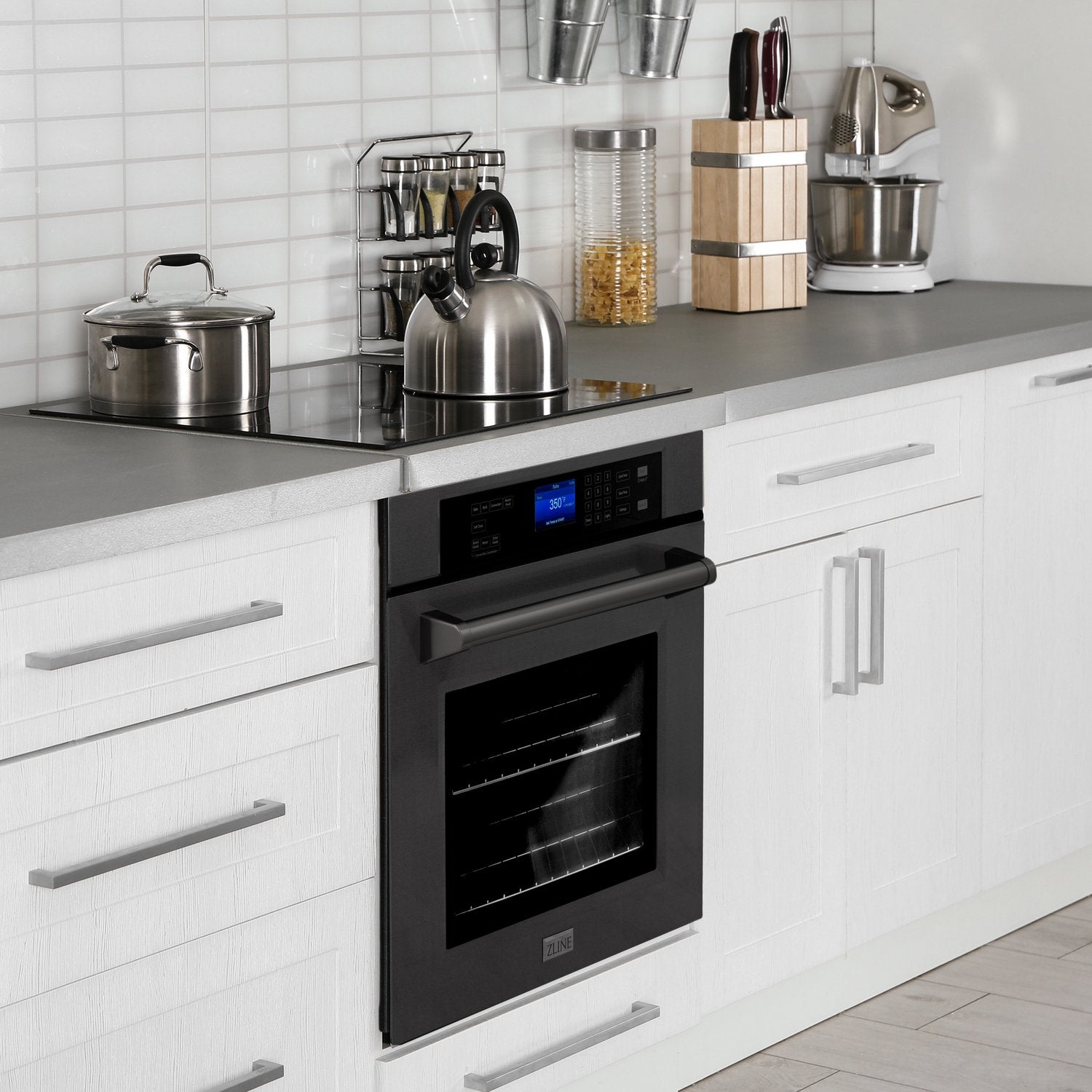 ZLINE single wall oven below induction cooktop in a compact kitchen