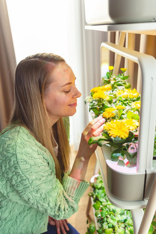 Women admiring plants in the Smart Garden 27.