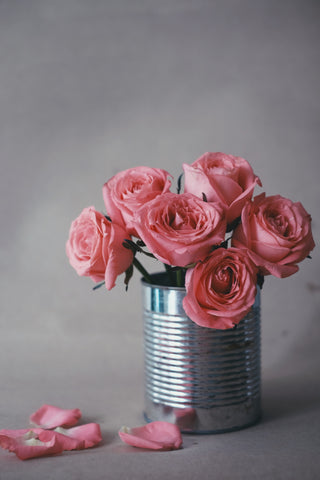 Pink roses in a tin can.