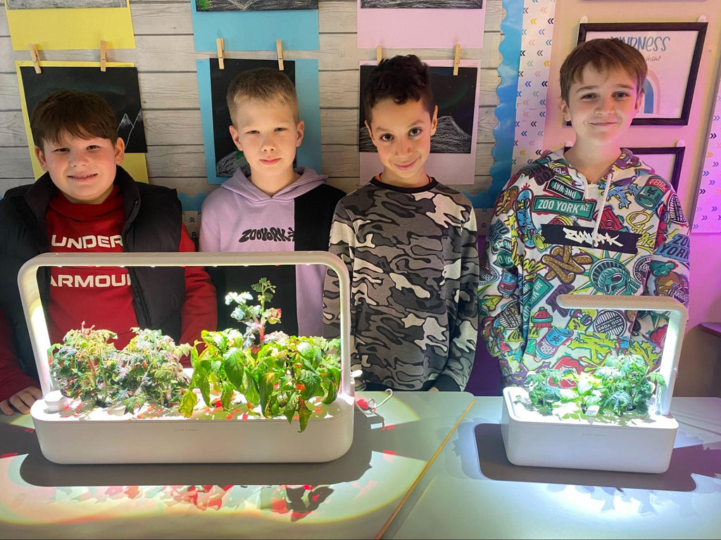 Students standing behind a Smart Garden 9.