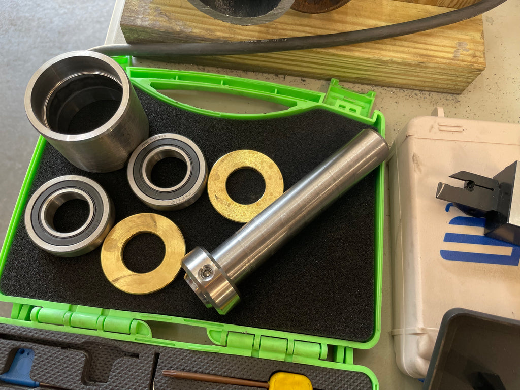 All the parts for the twister bar hubs—bearings, hub housing, bronze washers to serve as thrust bearings, shafts, and collars