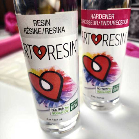 Art resin epoxy and hardener bottles