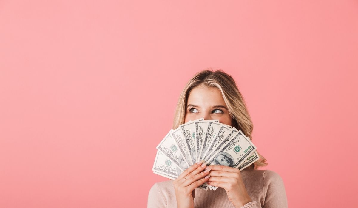 Young woman with dollar bills