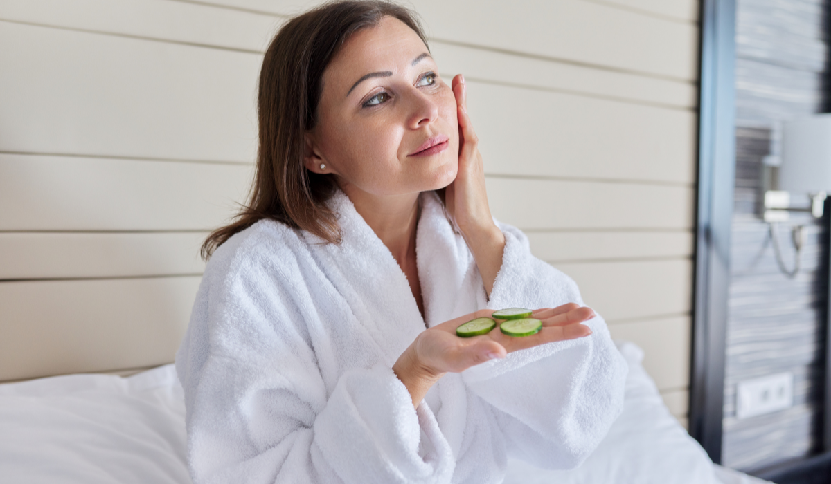 mature-female-in-bathrobe-doing-home-spa-treatment