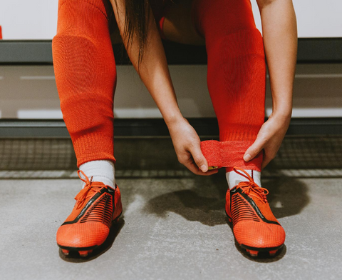 Self adhesive football sock wrap tape red