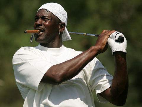 Michael Jordan playing golf with cigar