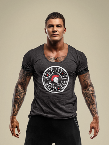 Tall, muscular man with tattooed arms, wearing a very dark gray t-shirt and representing a large coin, with a white Greek helmet inside with a red crest, and 3 red dots between the 3 words Frui Sine Mora inscribed in white capital and roman letters