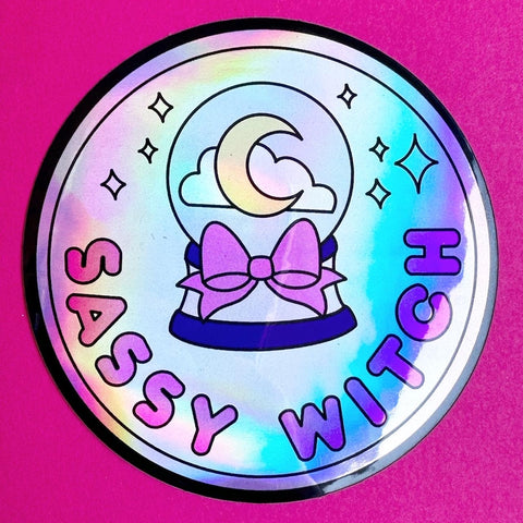 Sassy Witch Holographic Sticker with a crystal ball and bow on it