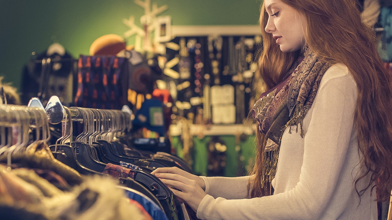 women shopping for new outfit at a clothing boutique