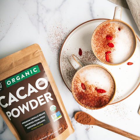 Cacao-maca latte (coffee alternative) made with From Great Origins Organic Cacao Powder and topped with Organic Goji Berries.
