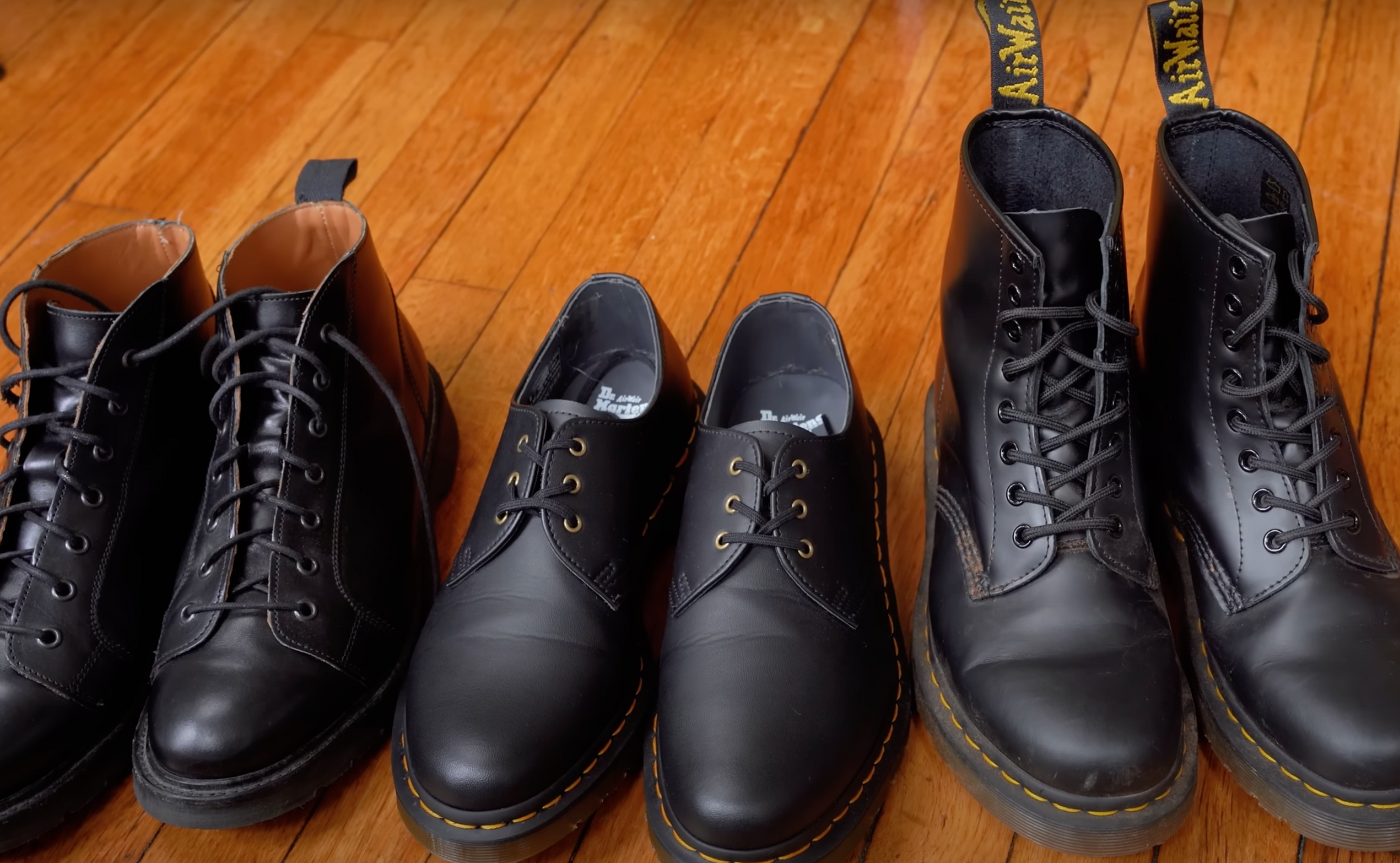 3 pairs of black leather shoes and boots, Solovair Monkey Boots, Dr. Martens 1461 Oxford Shoes, and Dr. Martens 1460 Boots