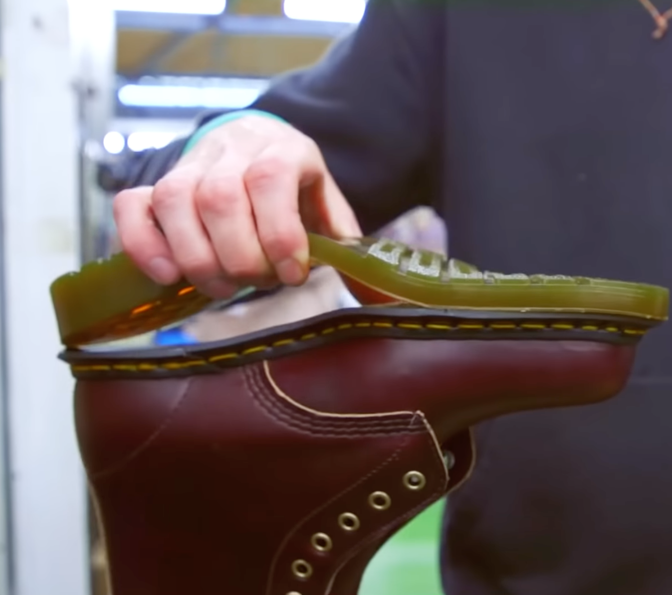 Dr. Martens Employee separating 1460 Boots sole from the boot