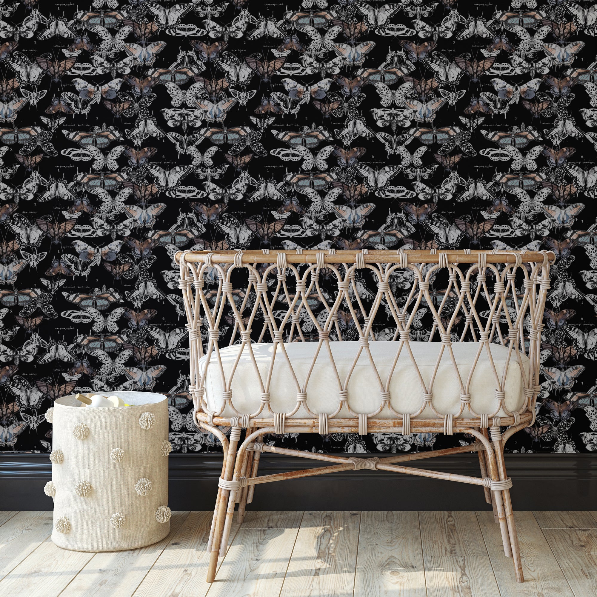 wicker crib with black butterfly wallpaper behind