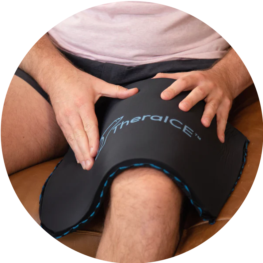 Person using a black knee ice pack therapy system.