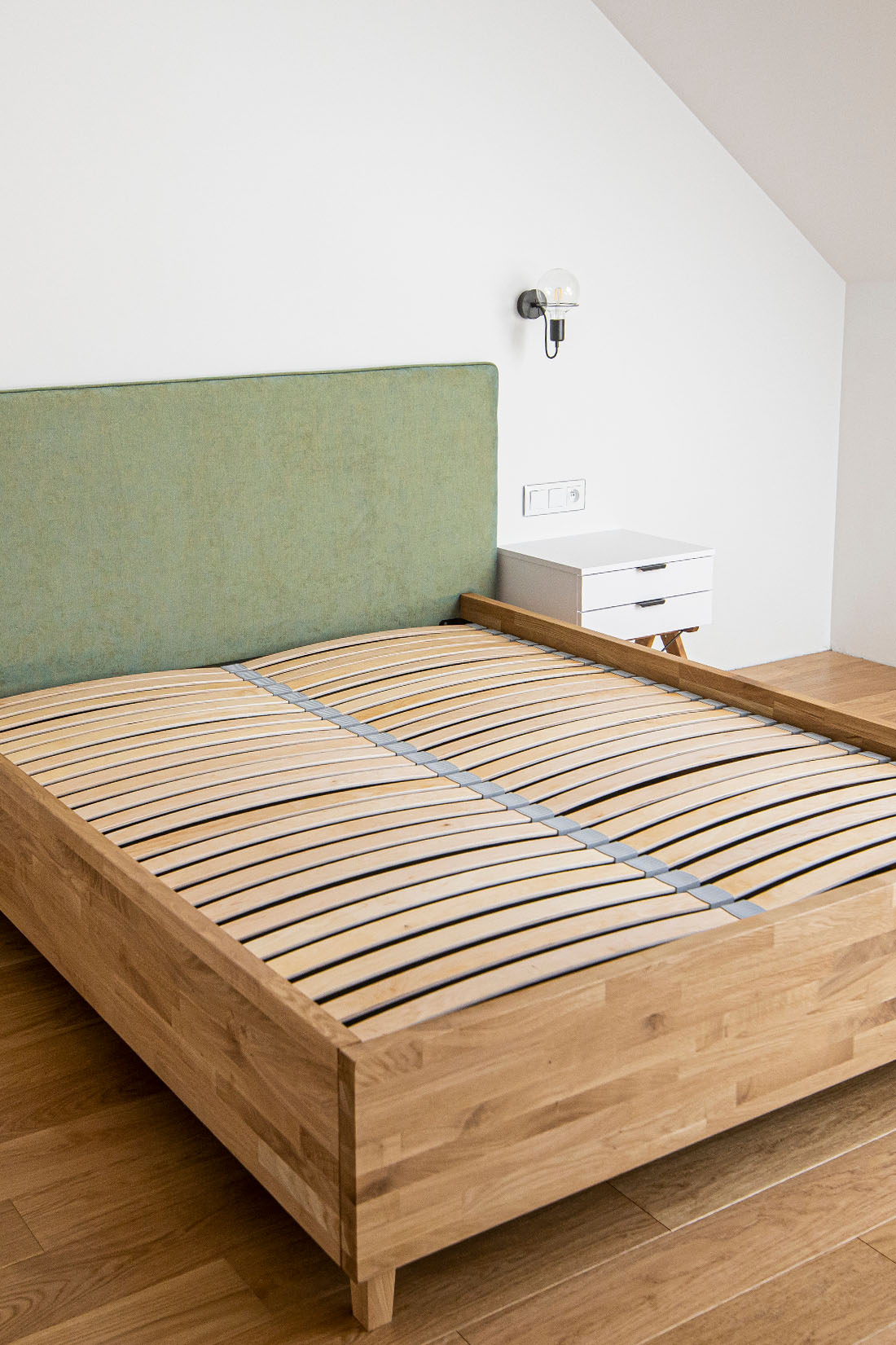 Green upholstered bed for each bedroom