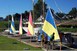 Programs at the Maritime Museum Gallery Image of Group of Kids getting ready to go sailing from H Lee White Maritime Museum Oswego NY