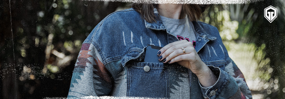 Lady keeping her minimalist wallet on her front jacket pocket - Generic Image