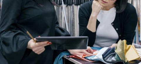 women checking quality of textile