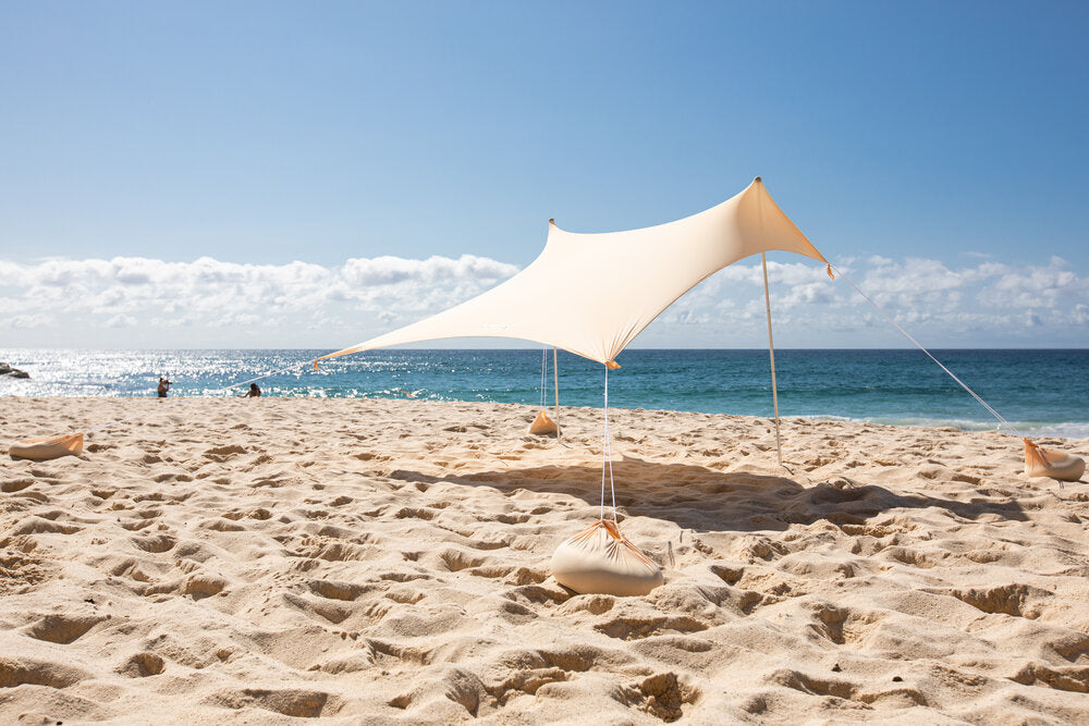 Beach staycations need shade, provided here by an Ozoola Beach Tent
