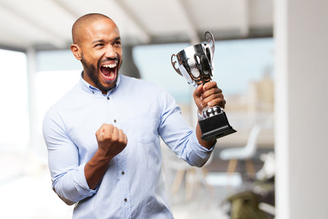 Man excited he won a trophy