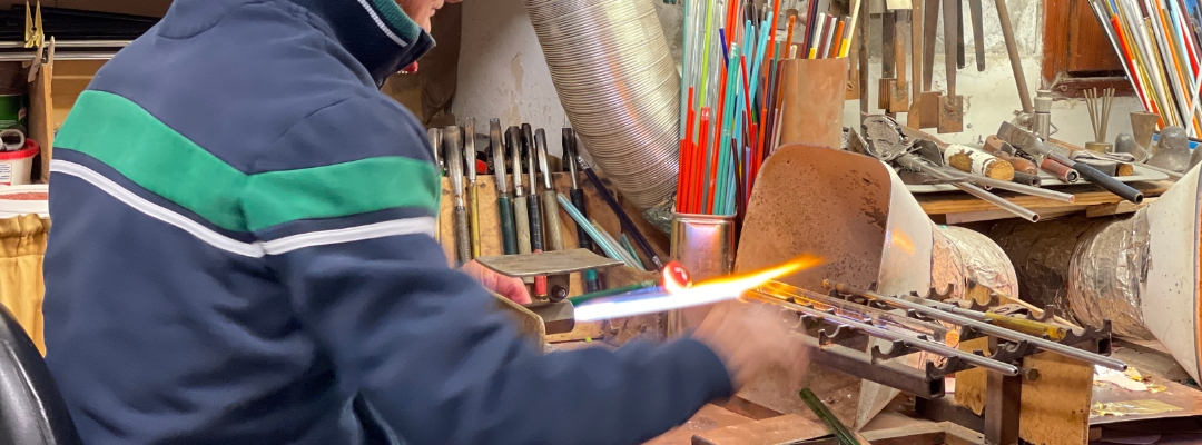 Glass artist at work in Murano, Italy