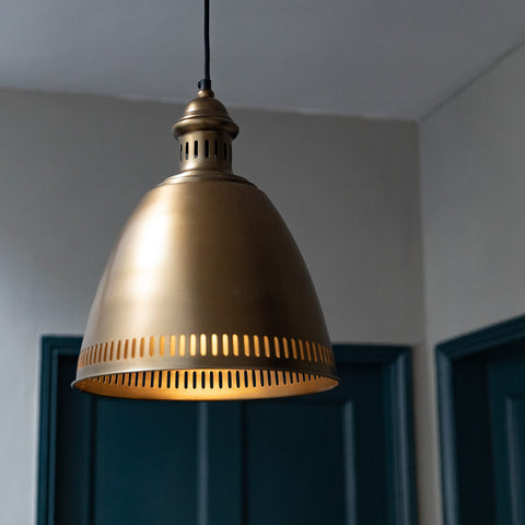 brass pendant light and blue doors