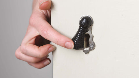 Ebony and Nickel Beehive escutcheon being used on a door