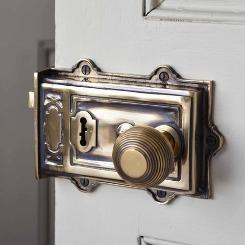 Brass rim lock on bathroom door