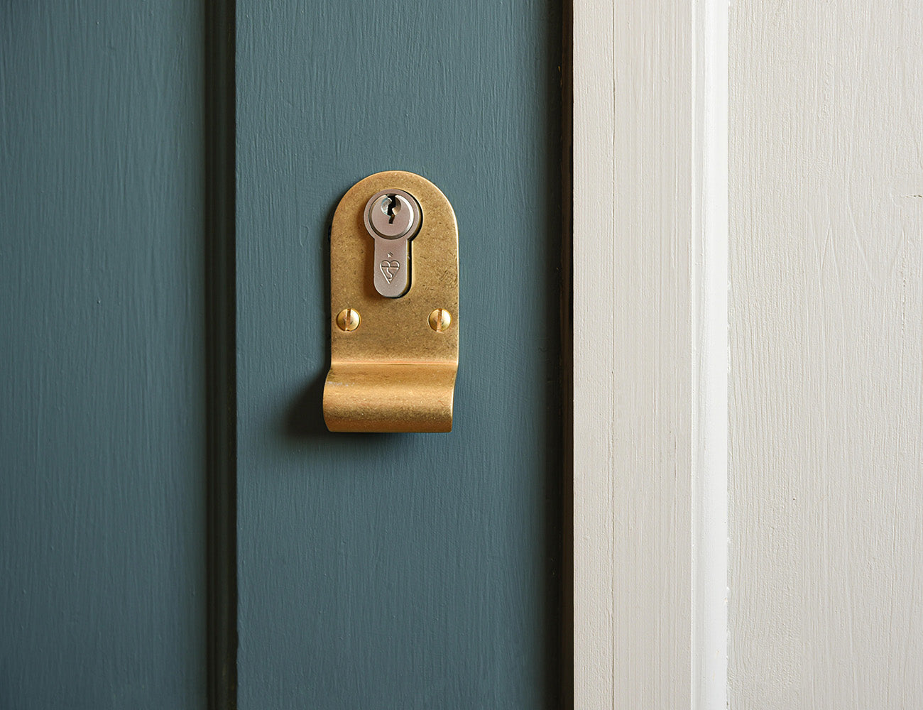 Aged Brass Latch Pull on a Dark Teal colour front door