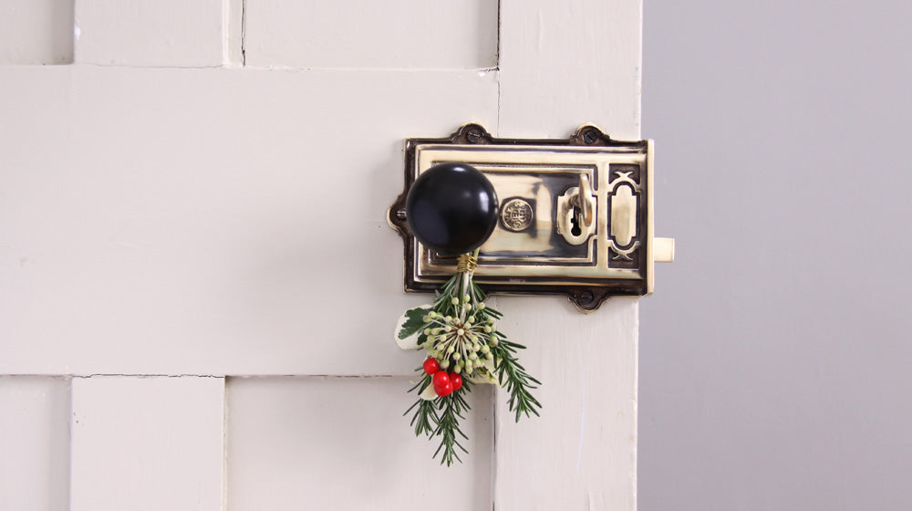 small festive foliage bunch hanging from door knob