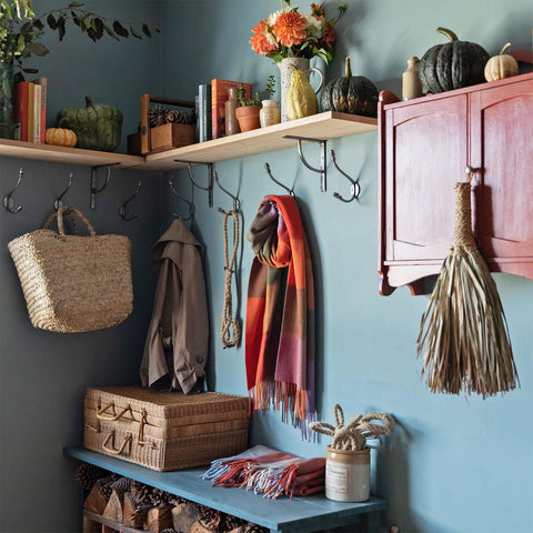 Blue boot room with shelves and hooks