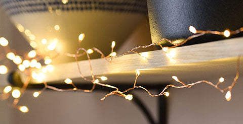 string of fairy lights on uni room shelf