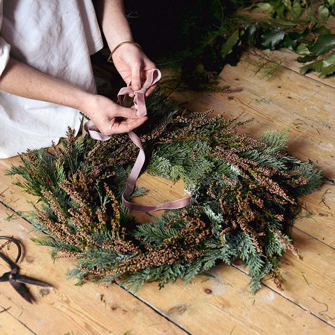 Adding velvet ribbon to a heather door wreath