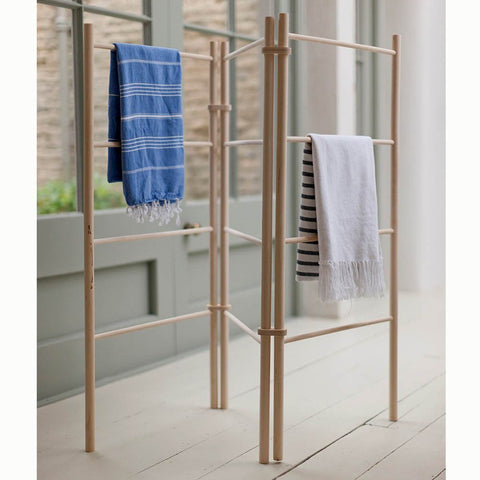 wooden zig zag clothes horse with laundry on