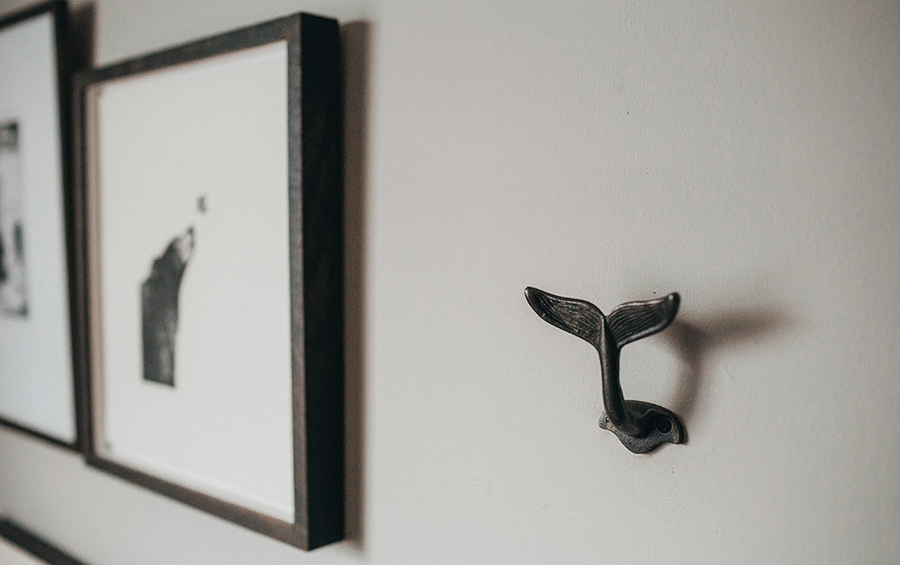 whale tale iron hook on bedroom wall