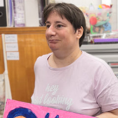 Disabled artist, Debbie with art