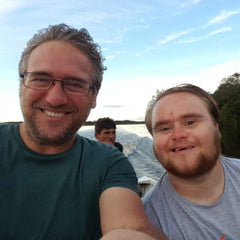 Fionnathan, father and son artists (Fionn has downs syndrome) on a speed boat happy. 