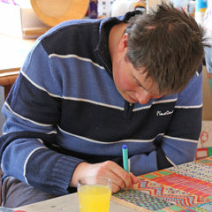 Disabled artist, George Cunningham art studio working concentration colour detail intricate