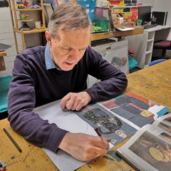 Disabled artist, Michael Lymbery in art studio pen and ink drawing